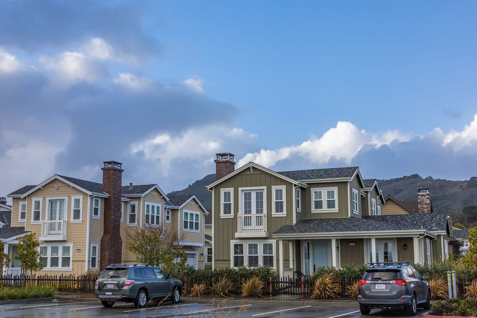 Street-level view of a row of homes captured by DrivePOV