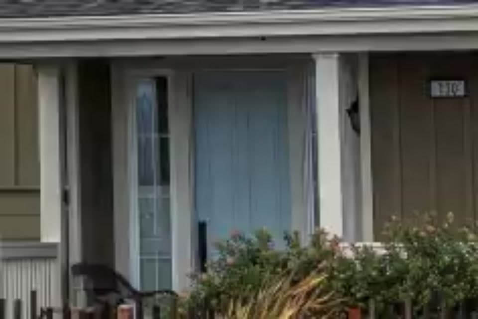Front door and its number with the pixels a 5.7K 360° camera puts on it, soft